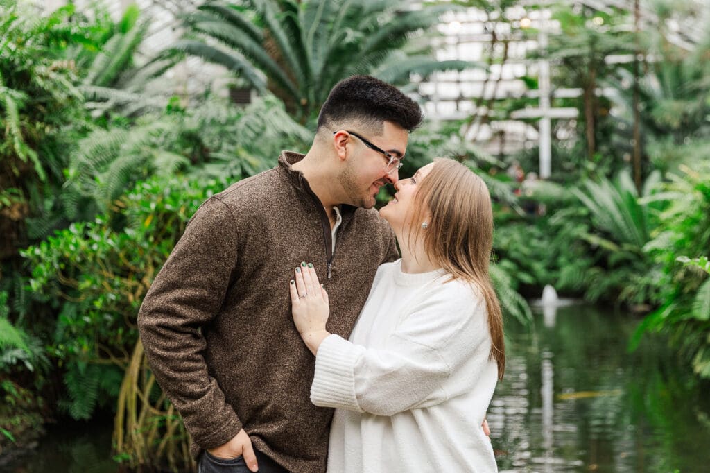 Couple looking at each other and smiling, touching noses together during their engagement session in Chicago