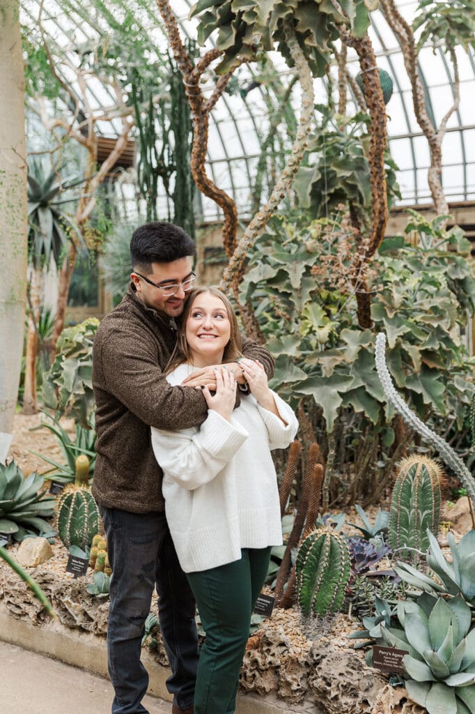 Couple standing together in a desert-themed room at the Garfield Park Conservatory